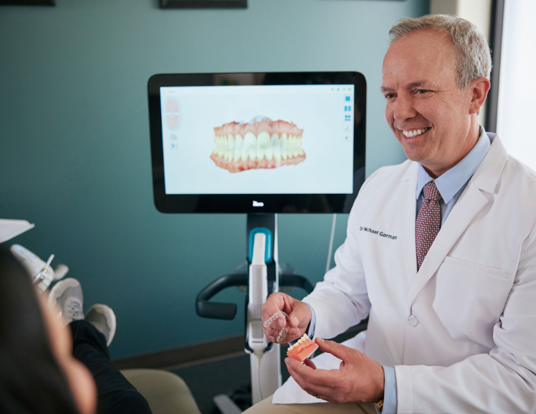 Dr. Gorman talking with Smiles for Centreville patient about Invisalign